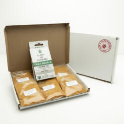 5 sachets 1 Tikka Masala Kit displayed in a letter postal box open with a closed box with a handpacked with love sticker