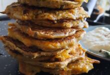 a stack of mini oat panckaes on top of a chapatti makeing pan a tawa