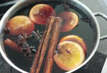 Pan full of spices and fruit with wine for mulled wine